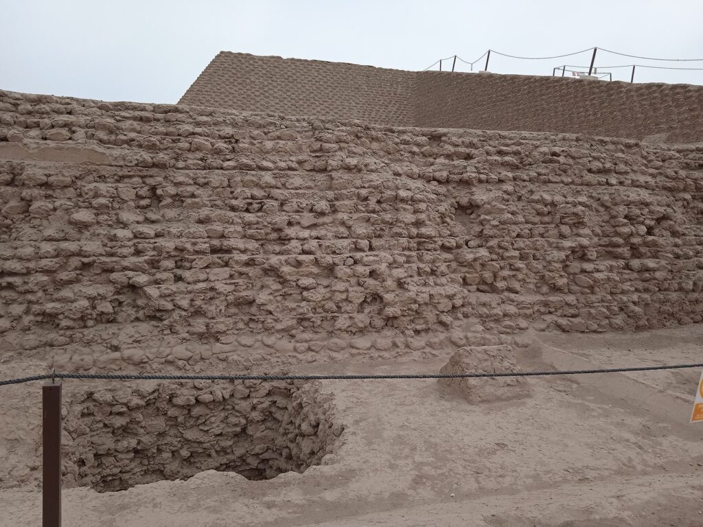 Adobe walls and the stepped profile of the Huaca Huallamarca pyramid in San Isidro, Lima