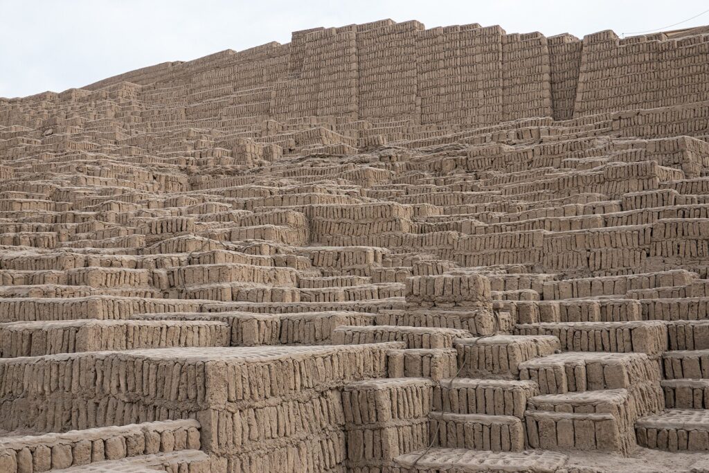 Stepped adobe brick walls of the Huaca Pucllana pyramid in Miraflores