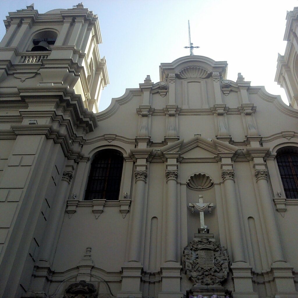 White baroque facade and bell towers of the church and monastery of Las Nazarenas in Lima, seen from below