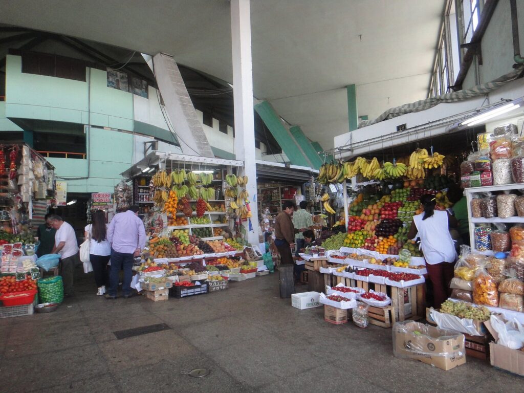 Fruit stalls piled with bananas and other fruit inside the Mercado N° 1 market in Surquillo, Lima