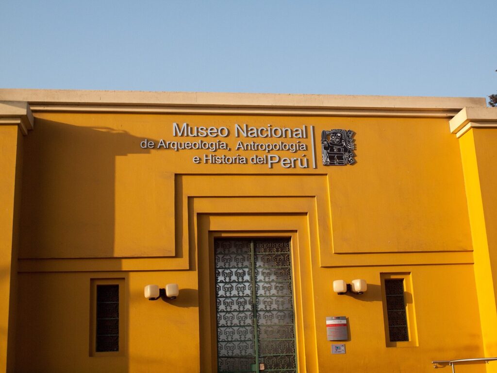 Ocher facade and entrance of the Museo Nacional de Arqueología, Antropología e Historia del Perú on Plaza Bolívar in Pueblo Libre, Lima